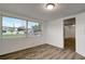 Bright bedroom featuring updated flooring and large windows for plenty of natural light at 517 Fairhope Dr, Apollo Beach, FL 33572