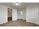 Bright bedroom featuring updated flooring, large closet and access to another room and exterior at 517 Fairhope Dr, Apollo Beach, FL 33572
