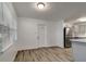 Dining area offering natural light, vinyl wood floors and an open layout to the kitchen at 517 Fairhope Dr, Apollo Beach, FL 33572