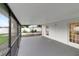 Screened patio with ample space, accessible through glass doors and a screened exit at 517 Fairhope Dr, Apollo Beach, FL 33572