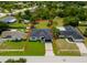 Aerial view of a single-story home with a lush lawn and a delineated property line at 5352 Lowell Ave, Spring Hill, FL 34609