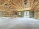 Spacious unfinished basement with block walls, exposed ceiling, and sliding glass doors at 5352 Lowell Ave, Spring Hill, FL 34609