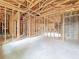 Unfinished basement featuring wood framing, concrete block walls, and an open layout at 5352 Lowell Ave, Spring Hill, FL 34609