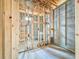Unfinished bathroom area shows wood framing, concrete block walls, and rough plumbing at 5352 Lowell Ave, Spring Hill, FL 34609