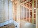 Unfinished bathroom area features wood framing, concrete block walls, and rough plumbing at 5352 Lowell Ave, Spring Hill, FL 34609