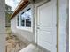 Exterior view of a new home under construction with white door, windows, and concrete block walls at 5352 Lowell Ave, Spring Hill, FL 34609
