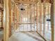 Interior view of unfinished room featuring wood framing and exposed utilities at 5352 Lowell Ave, Spring Hill, FL 34609