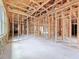Spacious interior view of wood framing, plumbing, and electrical components in new home at 5352 Lowell Ave, Spring Hill, FL 34609
