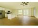 Open-concept kitchen and living area with stainless appliances, a center island, and a tile floor at 5352 Lowell Ave, Spring Hill, FL 34609