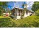 Manicured lawn with a storage shed and screened-in lanai in a fully fenced backyard at 6084 71St N Ave, Pinellas Park, FL 33781