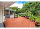 Charming backyard deck surrounded by lush greenery, perfect for relaxation and outdoor enjoyment at 6084 71St N Ave, Pinellas Park, FL 33781