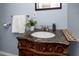 Elegant bathroom vanity featuring a marble countertop and ornate wooden cabinet at 6084 71St N Ave, Pinellas Park, FL 33781