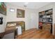 Bonus room featuring hardwood floors and ample storage space in built in shelving at 6084 71St N Ave, Pinellas Park, FL 33781