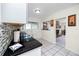 Bright kitchen with black countertops, backsplash, and a view of other rooms at 6084 71St N Ave, Pinellas Park, FL 33781