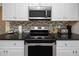 The kitchen features stainless steel appliances, granite countertops, and updated fixtures at 6084 71St N Ave, Pinellas Park, FL 33781