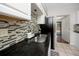 A well-lit kitchen area with granite countertops and a stylish backsplash at 6084 71St N Ave, Pinellas Park, FL 33781