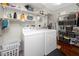 Laundry room featuring a washer, a dryer, and plenty of storage on shelving at 6084 71St N Ave, Pinellas Park, FL 33781