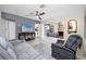 Spacious living room with a fireplace, gray sofa, and a television at 6084 71St N Ave, Pinellas Park, FL 33781