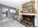 Inviting living room featuring a stone fireplace and artwork, offering a cozy and stylish atmosphere at 6084 71St N Ave, Pinellas Park, FL 33781