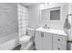 Bright bathroom featuring a shower/tub combo with a curtain and white vanity at 6236 93Rd N Ter # 3502, Pinellas Park, FL 33782