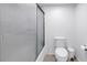 Shower/tub showcasing white tile surround and glass door, for modern aesthetics at 6236 93Rd N Ter # 3502, Pinellas Park, FL 33782