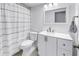 Bright bathroom featuring a shower/tub combo with a curtain and white vanity at 6236 93Rd N Ter # 3502, Pinellas Park, FL 33782