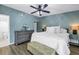 Bedroom with large bed, dresser, and a glimpse of a bathroom at 6236 93Rd N Ter # 3502, Pinellas Park, FL 33782