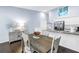 Cozy dining area adjacent to a modern kitchen with stainless steel appliances and ample counter space at 6236 93Rd N Ter # 3502, Pinellas Park, FL 33782