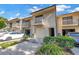 Exterior shot of townhomes, with balconies, garages, and well-kept landscaping at 6236 93Rd N Ter # 3502, Pinellas Park, FL 33782