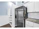 This modern kitchen has stainless steel refrigerator, white cabinets and stone countertops at 6236 93Rd N Ter # 3502, Pinellas Park, FL 33782