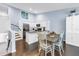Bright kitchen featuring white cabinets, granite countertops, stainless steel appliances and a connecting dining area at 6236 93Rd N Ter # 3502, Pinellas Park, FL 33782