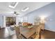 Light-filled living area with a dining table, sliding doors to an outdoor deck, and comfortable seating at 6236 93Rd N Ter # 3502, Pinellas Park, FL 33782