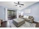 Relaxing living room with ceiling fan, plush seating, and sliding glass doors to the screened in patio at 6236 93Rd N Ter # 3502, Pinellas Park, FL 33782