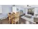 Bright living space featuring hardwood floors, a dining area, and sliding glass doors at 6236 93Rd N Ter # 3502, Pinellas Park, FL 33782