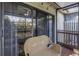 Relaxing screened patio featuring sliding glass doors, scenic views, and comfortable outdoor seating at 6236 93Rd N Ter # 3502, Pinellas Park, FL 33782