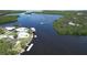Aerial view of waterfront homes showing boat docks and lush mangrove islands in a winding waterway at 6711 Arroyo Dr, New Port Richey, FL 34652