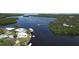 Overhead angle of waterfront homes showing docks, boats and winding channel through green mangrove islands at 6711 Arroyo Dr, New Port Richey, FL 34652
