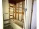 Unfinished bathroom featuring an old tub and exposed framing at 6711 Arroyo Dr, New Port Richey, FL 34652