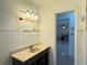 Bathroom with sink vanity and a view to an adjacent room at 6711 Arroyo Dr, New Port Richey, FL 34652