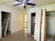Bright bedroom featuring paneled walls and an adjoining doorway at 6711 Arroyo Dr, New Port Richey, FL 34652
