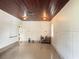 Spacious garage featuring tile floors and fresh white paint at 6711 Arroyo Dr, New Port Richey, FL 34652