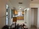 Kitchen featuring granite countertops, wood cabinets, and tile backsplash at 6711 Arroyo Dr, New Port Richey, FL 34652