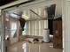 Enclosed sunroom featuring tile flooring, window blinds, and a water heater at 6711 Arroyo Dr, New Port Richey, FL 34652