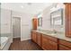 Bright bathroom featuring a double vanity, garden tub, and neutral paint at 7333 S Trask St, Tampa, FL 33616