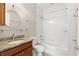 Bathroom featuring granite counters, a round mirror, and a shower-tub combination at 7333 S Trask St, Tampa, FL 33616
