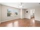 Bright bedroom featuring hardwood floors, neutral paint, and a ceiling fan at 7333 S Trask St, Tampa, FL 33616
