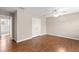 Bedroom featuring hardwood floors and a view of the closet and bathroom at 7333 S Trask St, Tampa, FL 33616