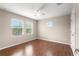 Light-filled bedroom with hardwood floors and a ceiling fan at 7333 S Trask St, Tampa, FL 33616