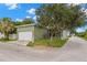Exterior view of the house with garage and well-maintained lawn at 7333 S Trask St, Tampa, FL 33616