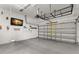 Spacious garage with ample storage options and a television for entertainment at 7333 S Trask St, Tampa, FL 33616